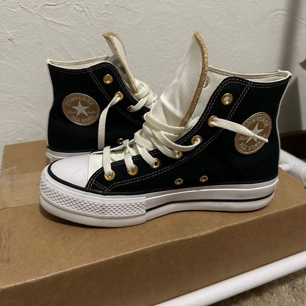 Converse Chuck Taylor Women's Black and White High-Tops with Gold Accents